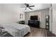 This bedroom features a ceiling fan, a large dresser, and hardwood flooring at 5550 Ramirez St, North Las Vegas, NV 89031