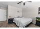 Cozy bedroom with luxury vinyl plank flooring and a ceiling fan at 5550 Ramirez St, North Las Vegas, NV 89031