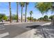 Gated community entrance featuring mature palm trees and meticulously maintained landscaping at 5550 Ramirez St, North Las Vegas, NV 89031