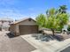 Well-maintained home with a two-car garage and established landscaping in the front yard at 5550 Ramirez St, North Las Vegas, NV 89031