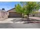 Charming single-story home features a two-car garage and well-maintained landscaping at 5550 Ramirez St, North Las Vegas, NV 89031