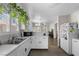 Lovely kitchen features a microwave, stainless steel sink, and tile flooring at 5550 Ramirez St, North Las Vegas, NV 89031