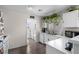 Bright kitchen area with white countertops and cabinets, and stainless steel appliances at 5550 Ramirez St, North Las Vegas, NV 89031