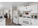 Functional kitchen with white appliances and ample storage space at 5550 Ramirez St, North Las Vegas, NV 89031