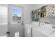 Bright laundry room with a door leading to the outside at 5550 Ramirez St, North Las Vegas, NV 89031