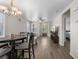 Open-concept living and dining area with stylish decor, wood floors, and plenty of natural light throughout the space at 5550 Ramirez St, North Las Vegas, NV 89031