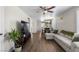 Inviting living room features wood floors, a ceiling fan, and comfortable seating at 5550 Ramirez St, North Las Vegas, NV 89031