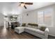 Inviting living room with modern furnishings, wood-look floors, ample natural light, and an open floor plan at 5550 Ramirez St, North Las Vegas, NV 89031