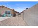 Gravel side yard with access gate to backyard area at 5550 Ramirez St, North Las Vegas, NV 89031