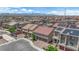 An aerial view captures a neighborhood with uniform home styles, complete with a view of the surrounding desert landscape at 5788 Robin Ridge Ave, Las Vegas, NV 89141