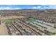 Aerial view of the neighborhood and community, showcasing multiple homes and wide open desert views at 5788 Robin Ridge Ave, Las Vegas, NV 89141