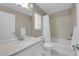 Neutral bathroom with white cabinet, shower-tub combo with shower curtain, and modern fixtures at 5788 Robin Ridge Ave, Las Vegas, NV 89141