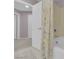 Bathroom featuring a shower-tub combo, a beige shower curtain, and a white door at 5788 Robin Ridge Ave, Las Vegas, NV 89141