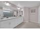 Luxurious bathroom featuring dual vanities, a spacious shower, and elegant finishes at 5788 Robin Ridge Ave, Las Vegas, NV 89141