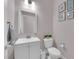 Charming half bathroom with coastal decor, a modern vanity, and a standard toilet at 5788 Robin Ridge Ave, Las Vegas, NV 89141
