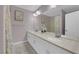 Elegant bathroom features dual sinks, a large mirror, and stylish lighting fixtures at 5788 Robin Ridge Ave, Las Vegas, NV 89141