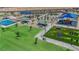 Image highlights a community park with varied playground equipment, picnic shelters and grassy areas at 5788 Robin Ridge Ave, Las Vegas, NV 89141