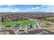 Aerial view of the community park with play areas, open green spaces and surrounding residential development at 5788 Robin Ridge Ave, Las Vegas, NV 89141