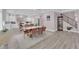 Elegant dining area with seating for eight, open to kitchen and stairs at 5788 Robin Ridge Ave, Las Vegas, NV 89141