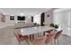 Open-concept dining room with marble top table and seamless flow to the living area at 5788 Robin Ridge Ave, Las Vegas, NV 89141