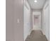 Hallway with light grey walls, white doors, and carpeted flooring at 5788 Robin Ridge Ave, Las Vegas, NV 89141