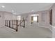 Upstairs hallway offering views of rooms with neutral paint, carpet, and modern railings at 5788 Robin Ridge Ave, Las Vegas, NV 89141