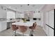 Chic kitchen with marble countertops, an island with bar stools, and modern appliances at 5788 Robin Ridge Ave, Las Vegas, NV 89141