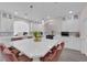 Modern kitchen with sleek white countertops, cabinetry, and stainless steel appliances at 5788 Robin Ridge Ave, Las Vegas, NV 89141