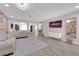 Spacious living room with modern decor, an accent wall, and an open floor plan at 5788 Robin Ridge Ave, Las Vegas, NV 89141