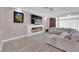 Cozy living room with a fireplace, large television, and comfortable seating at 5788 Robin Ridge Ave, Las Vegas, NV 89141