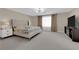 Bright main bedroom with carpet flooring, recessed lights, and neutral decor at 5788 Robin Ridge Ave, Las Vegas, NV 89141
