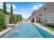 Backyard pool features water features, privacy landscaping, and a covered patio at 5788 Robin Ridge Ave, Las Vegas, NV 89141
