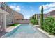 Beautiful private pool with tiered waterfalls, lush landscaping, and elegant design at 5788 Robin Ridge Ave, Las Vegas, NV 89141