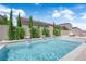Backyard pool features water features, privacy landscaping, and a sunny blue sky at 5788 Robin Ridge Ave, Las Vegas, NV 89141