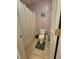 Cozy bathroom features neutral tile, toilet, bath tub and modern fixtures at 6009 Arbor Crest St, North Las Vegas, NV 89081