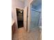 Bright bathroom with glass-enclosed shower and tan tiled flooring at 6009 Arbor Crest St, North Las Vegas, NV 89081