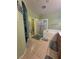 Bathroom featuring tile flooring, double vanity, shower and tub combo at 6009 Arbor Crest St, North Las Vegas, NV 89081