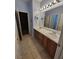 Bathroom featuring double sinks and tiled flooring at 6009 Arbor Crest St, North Las Vegas, NV 89081