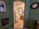A bathroom with a bathtub, vanity, and an arched entrance at 6009 Arbor Crest St, North Las Vegas, NV 89081