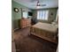 Comfortable bedroom with carpeted floors, a ceiling fan, and a window with plantation shutters at 6009 Arbor Crest St, North Las Vegas, NV 89081