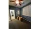 Bedroom with ceiling fan, carpeted flooring and window at 6009 Arbor Crest St, North Las Vegas, NV 89081