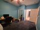 Bedroom with ceiling fan, desk, and closet at 6009 Arbor Crest St, North Las Vegas, NV 89081