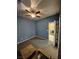 Spacious bedroom featuring a ceiling fan and an open doorway to the laundry area at 6009 Arbor Crest St, North Las Vegas, NV 89081