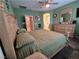 Spacious bedroom featuring a ceiling fan, king bed and a vanity area at 6009 Arbor Crest St, North Las Vegas, NV 89081