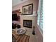 Cozy fireplace in the living room with a decorative mantel, tile surround, and a comfortable pet bed nearby at 6009 Arbor Crest St, North Las Vegas, NV 89081