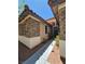 The front exterior of the house shows stone accents, complemented by well-maintained landscaping at 6009 Arbor Crest St, North Las Vegas, NV 89081