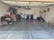 Spacious garage featuring overhead storage and extra space for parking at 6009 Arbor Crest St, North Las Vegas, NV 89081