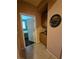 Hallway view leading into a bedroom with a glimpse of the room's interior and a cabinet at 6009 Arbor Crest St, North Las Vegas, NV 89081