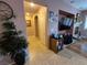 Hallway with access to other parts of the home, showing tile flooring and a view of the living room at 6009 Arbor Crest St, North Las Vegas, NV 89081