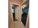 Hallway view of two rooms with doors ajar at 6009 Arbor Crest St, North Las Vegas, NV 89081
